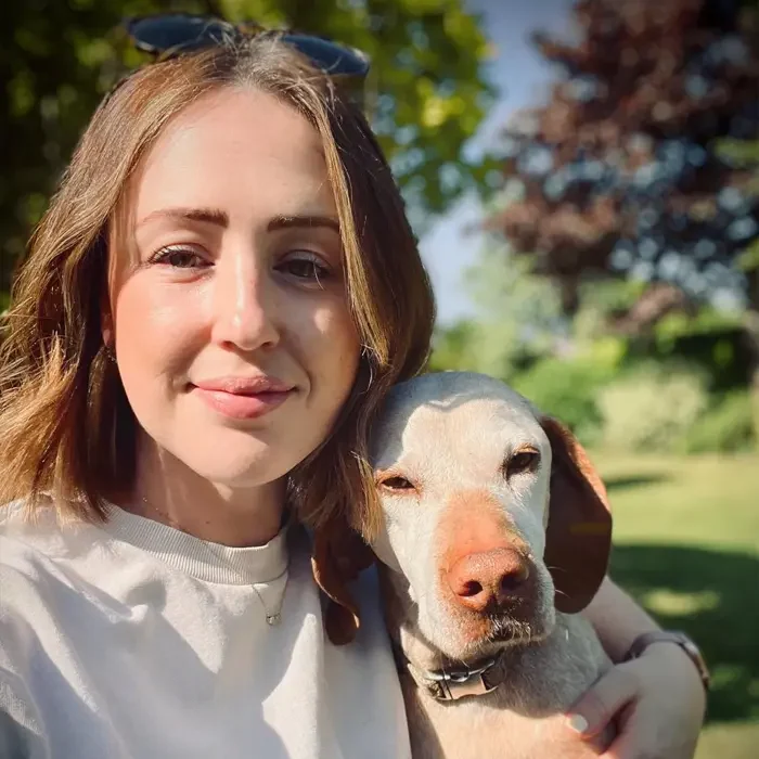 sam from nova vets hugging dog